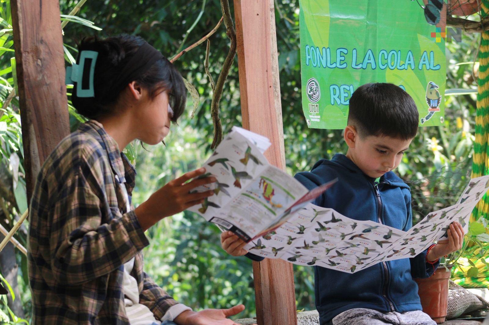 Niñas y niños participan en jornada de observación de aves en Naranjal